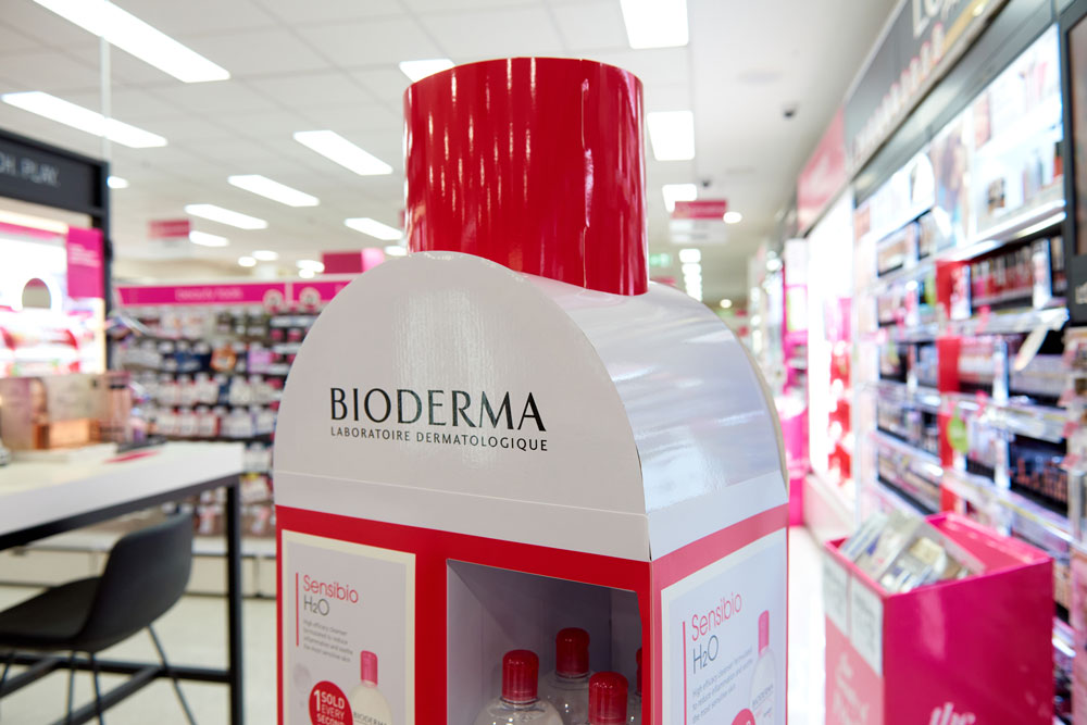 The Bioderma product display stand with brand logo and signage at the top
