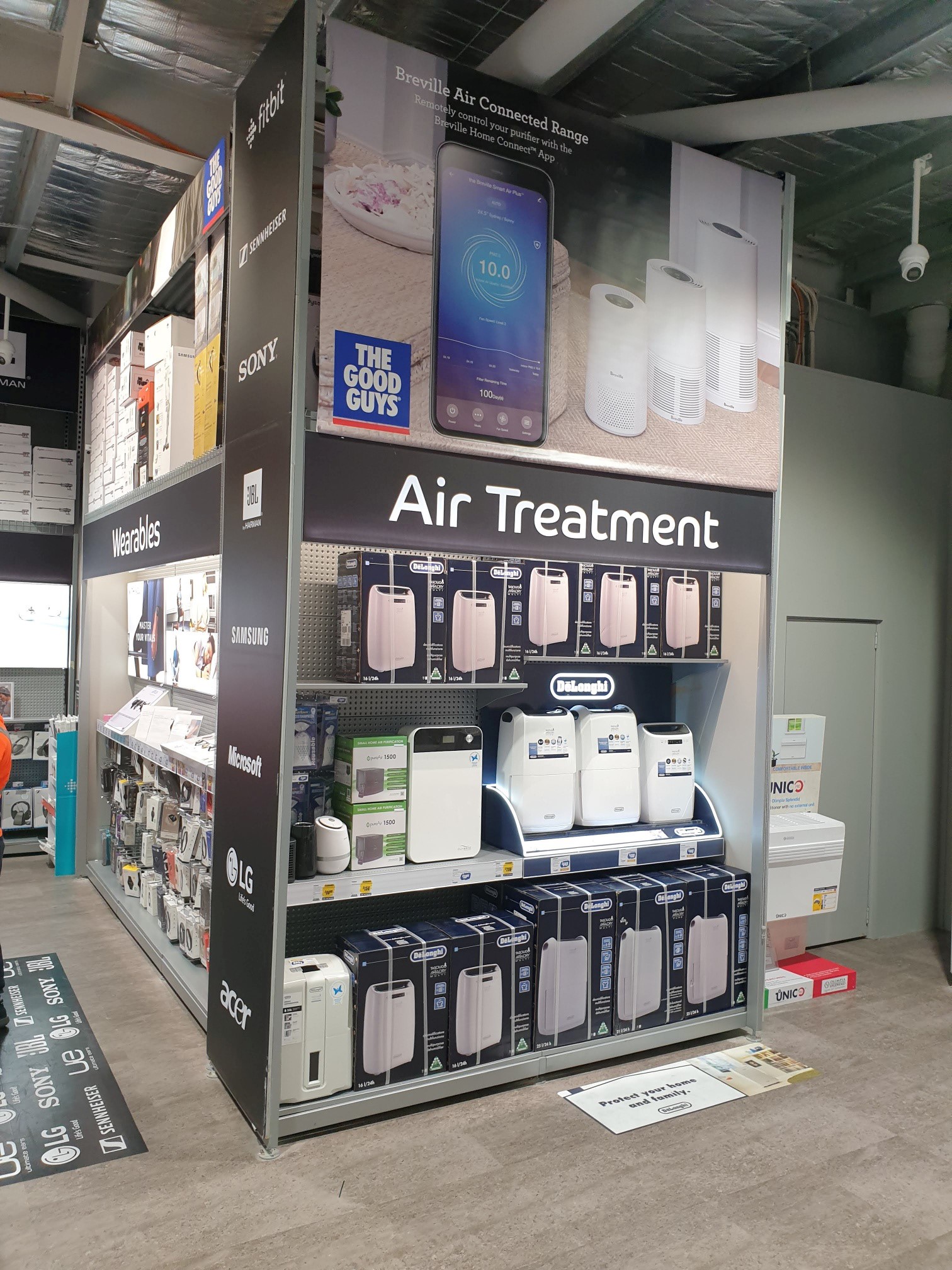 DeLonghi Dehumidifier in-store product stand with signage at The Good Guys