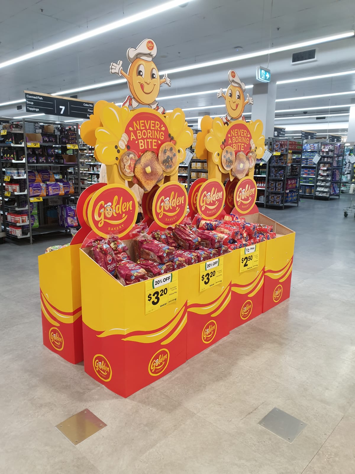 Golden Bakery product bin stands in the middle of grocery store