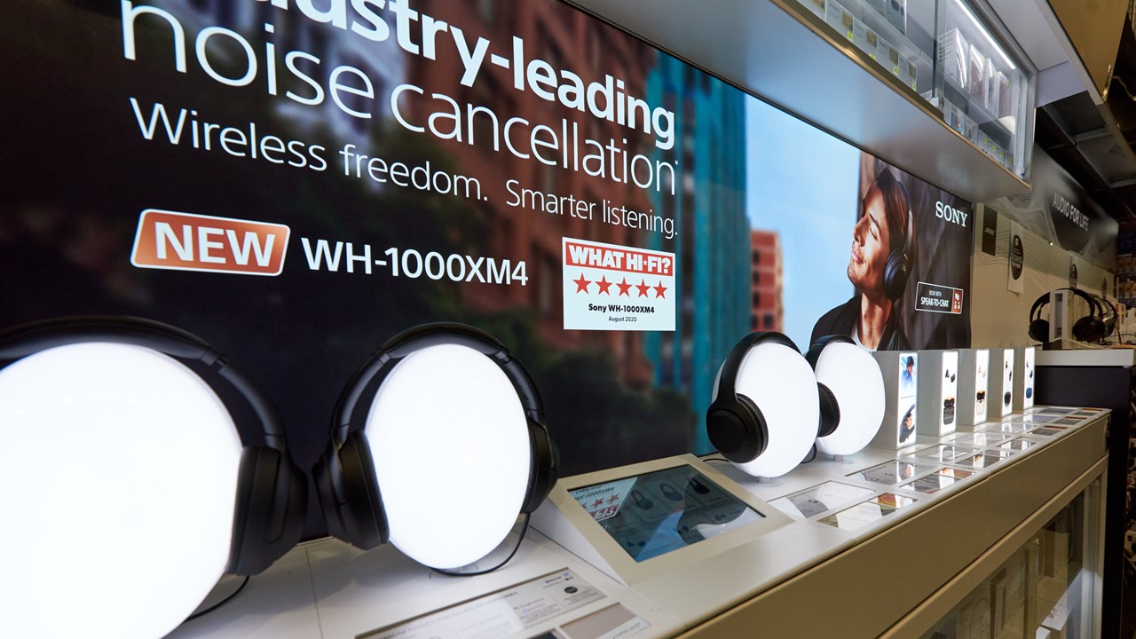 Sony display for noise-calling headphones on light box head stands